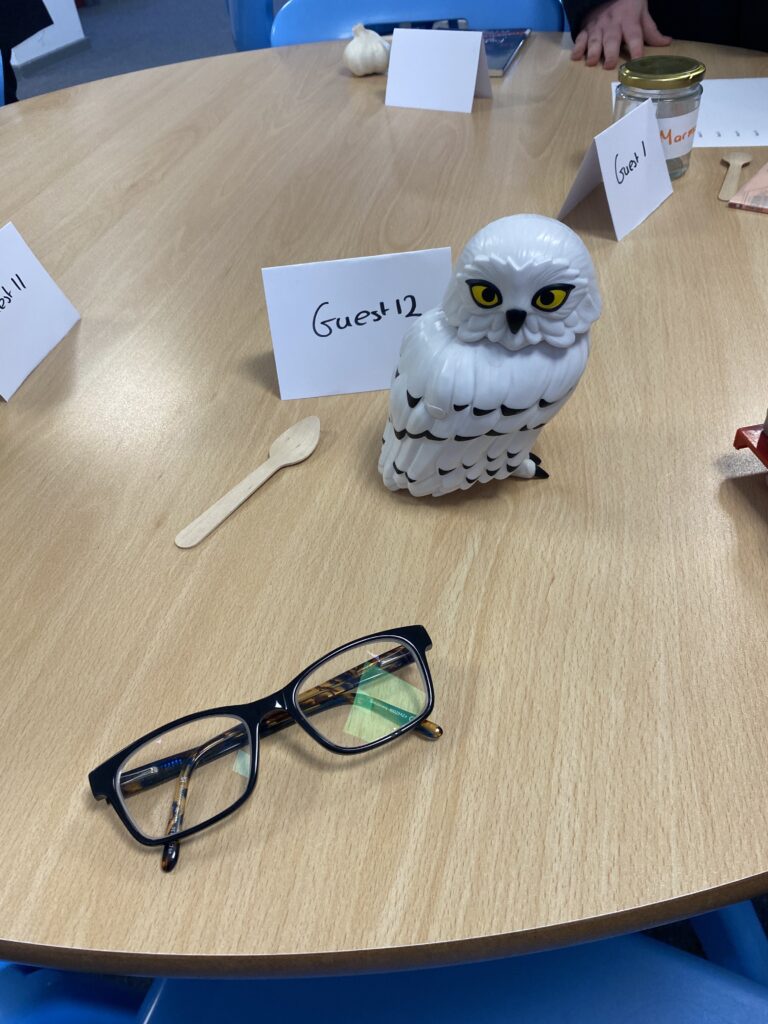 An owl and other items on a table