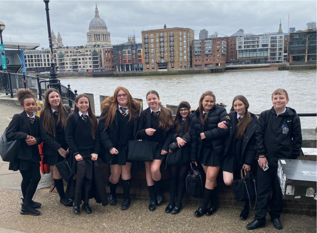 Students on the South Bank standing outside the Globe theatre