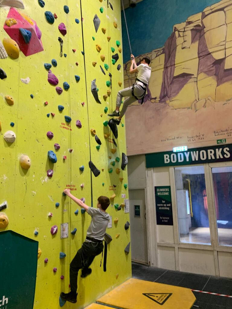 Students on a rock climbing wall
