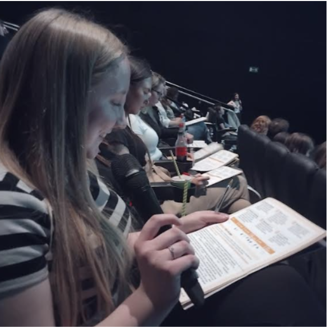 Students asking a question at a psychology conference