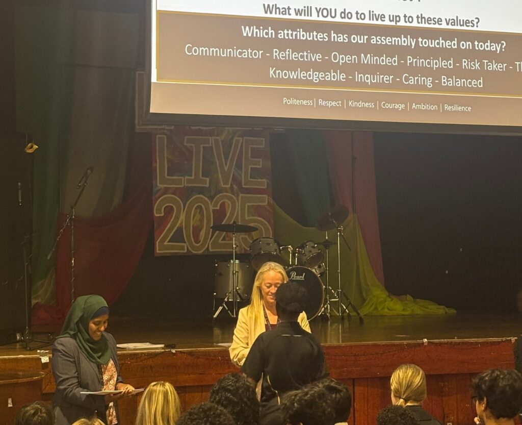 Pupils receive certificates in an assembly