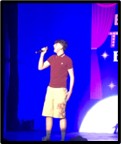 student singing on stage fore Bexley talent encore