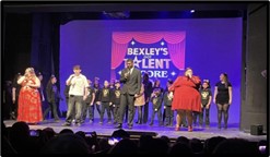 group of student performing on a stage for Bexley talent encore